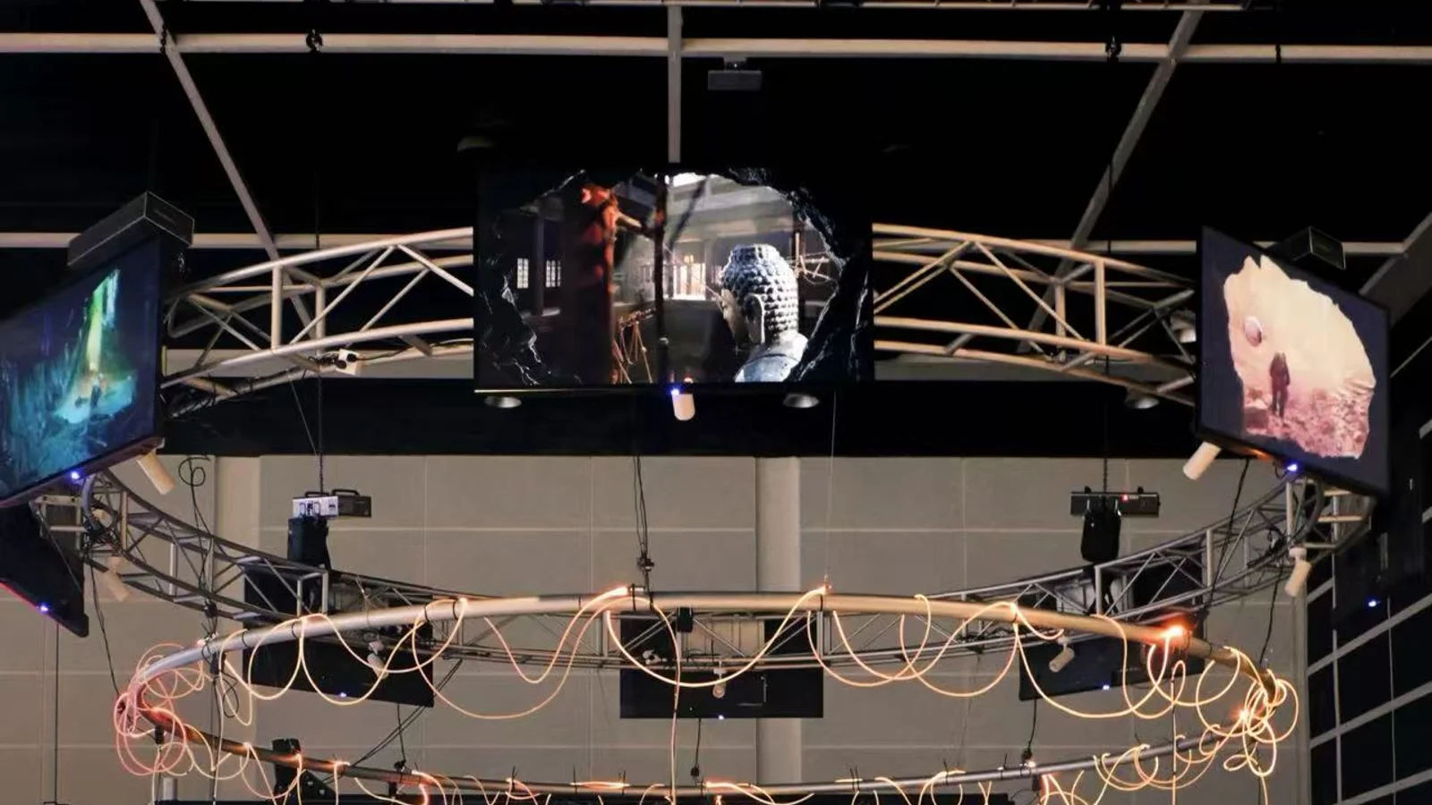 Deepcore VR installation at the Hong Kong International AI Art Festival, showing the circular rig with suspended screens and headsets