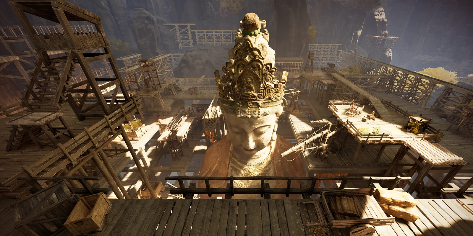 A monumental Buddha under construction among timber platforms in the Longmen chapter